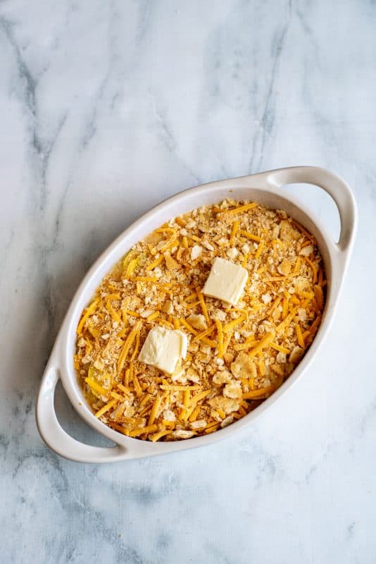 Top squash casserole with remaining crackers and dot with butter.