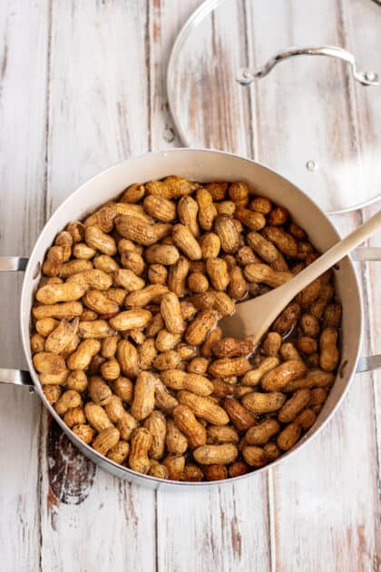 Stir together peanuts and salt.