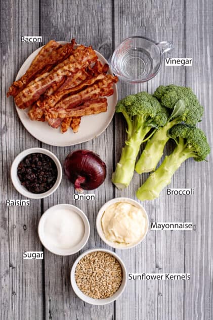 Labeled ingredients for broccoli salad with bacon.