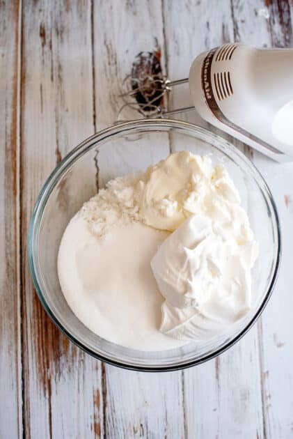 Add icing ingredients to a mixing bowl.