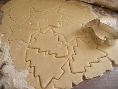 Cut out cookies using Christmas cutters.