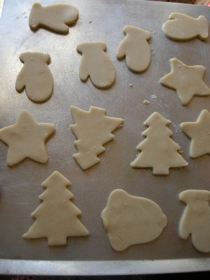 Christmas cutout cookies on baking sheet.