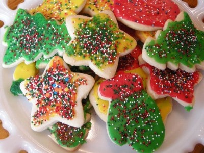 A plate of Christmas cutout cookies.