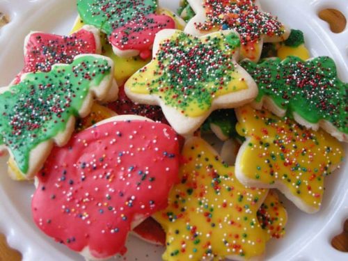 Plate of Christmas cutout cookies.