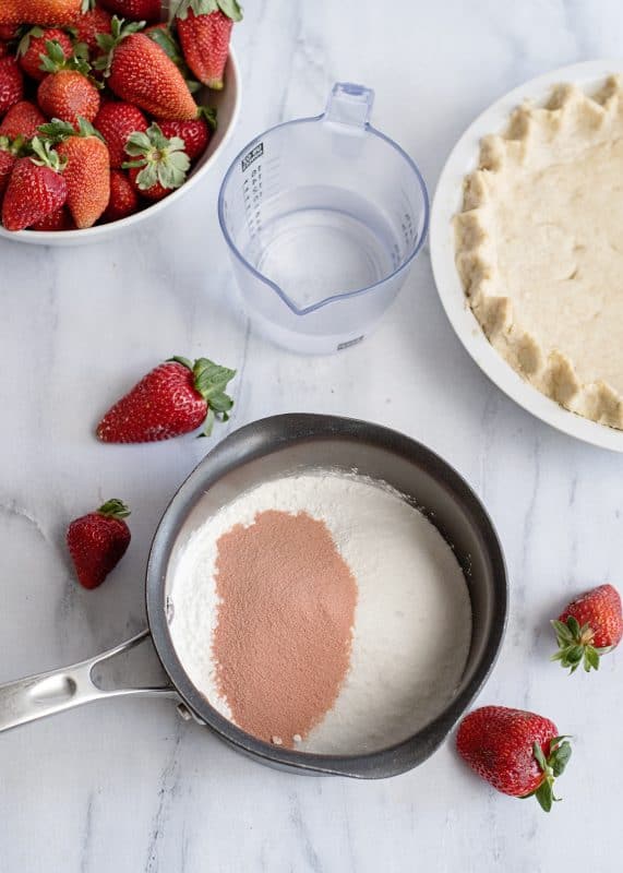 Mix together jello, sugar, and cornstarch in saucepot.