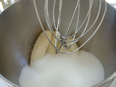 Add sugar to mixing bowl and beat together.