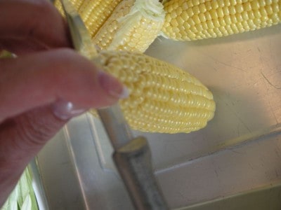 Use a sharp knife to remove the corn kernels.