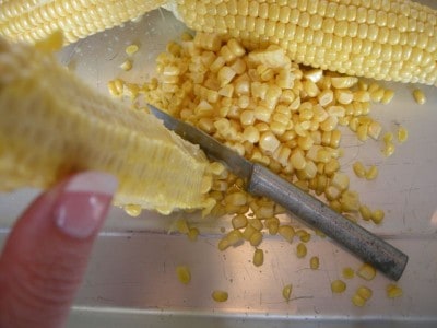 Removing the corn kernels.