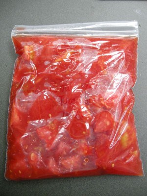 Freezer bag filled with tomatoes.