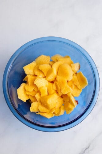 Chopped peaches in mixing bowl.