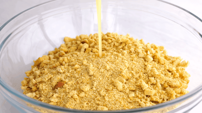 Pouring margarine onto stuffing mixture