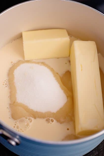 Place margarine, milk, and sugar into a pot.