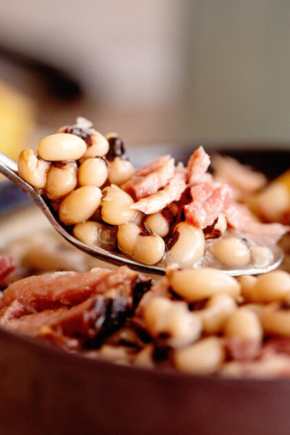 Spoonful of black eyed peas and ham