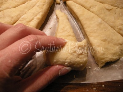 roll wedges to form crescent rolls