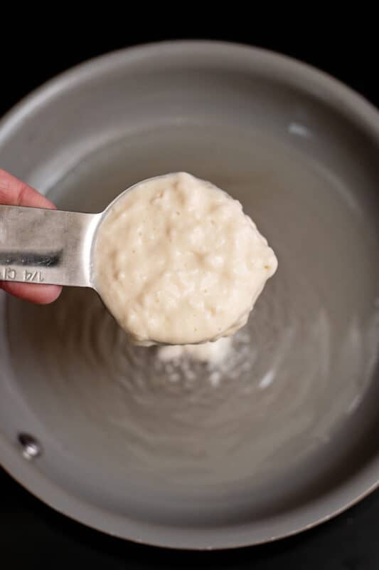 Add a quarter cup of the pancake batter to the skillet.