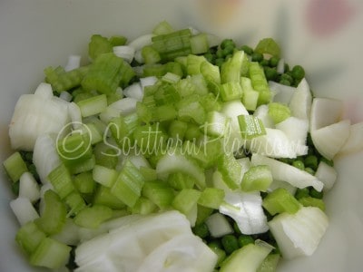 Add chopped celery to bowl.