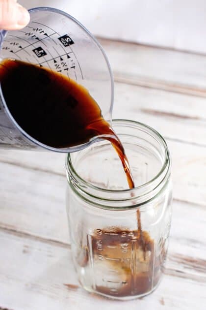 Place soy sauce in large jar.