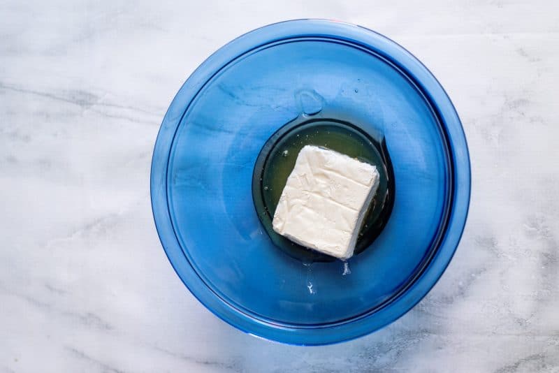 Place cream cheese and honey in a mixing bowl.