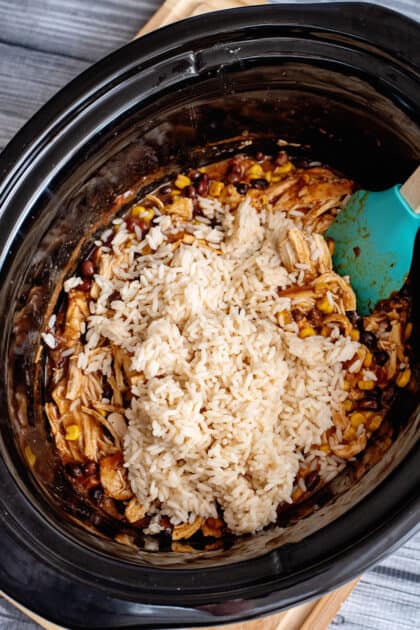 Before serving, mix cooked rice into the slow cooker.