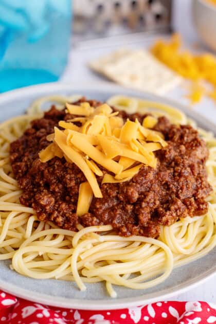 Cincinnati spaghetti topped with shredded cheese.