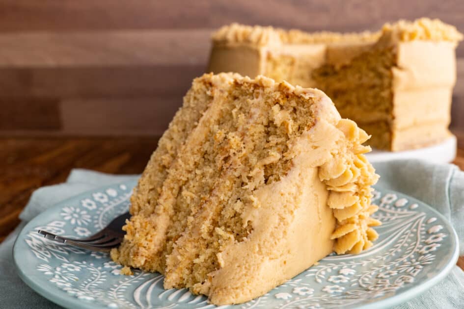 Slice of peanut butter cake with peanut butter frosting.