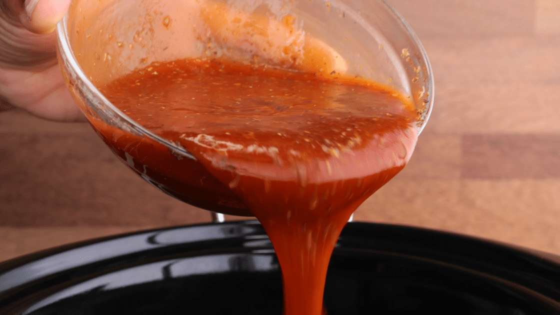 Pour sauce into slow cooker over patties.