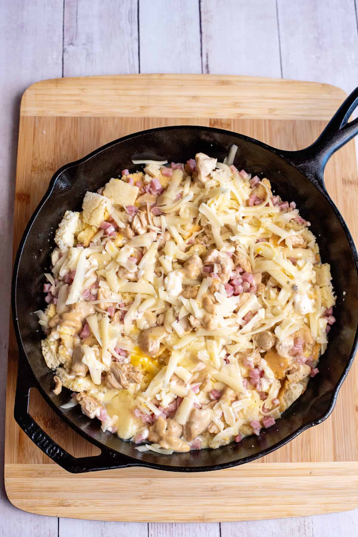 pour mixture over the cornbread in the skillet