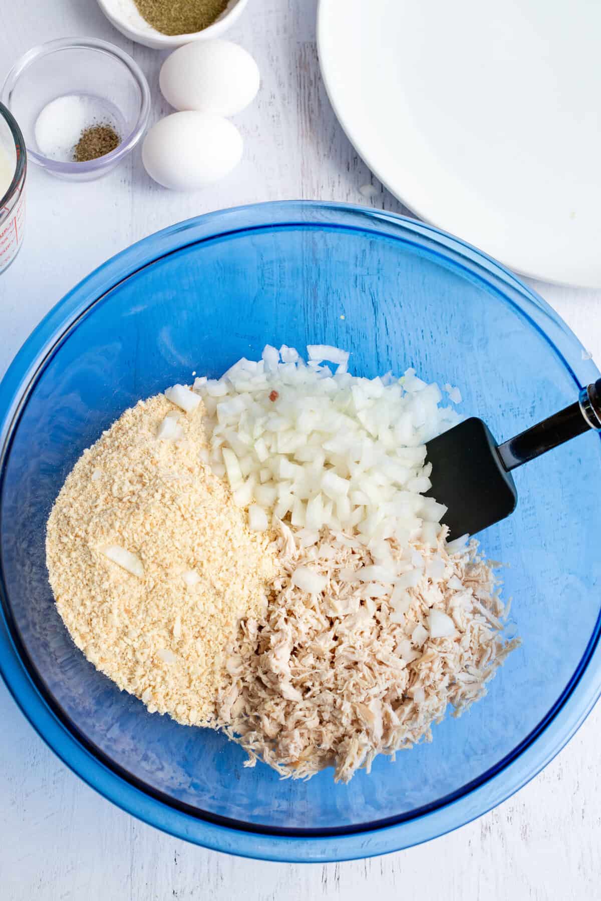 place chicken, crackers, and onion in a separate bowl