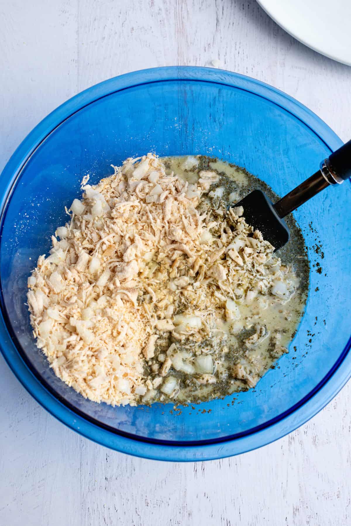 pour liquid ingredients into the chicken mixture