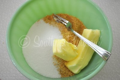 Cut together sugar, graham crumbs, and butter in a bowl.