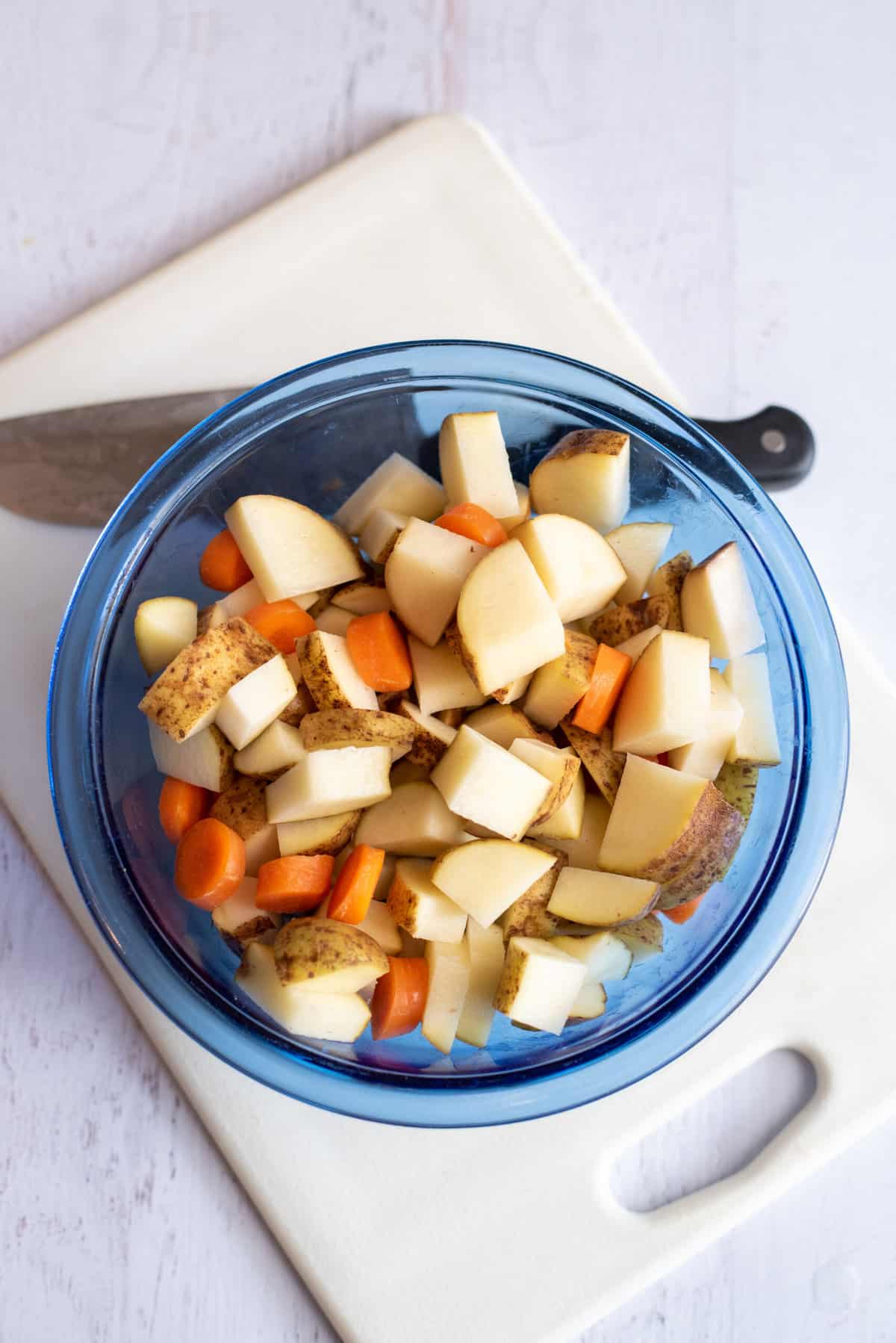 Peel and chop vegetables for country chowder