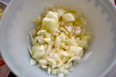 Add onion to cream cheese in mixing bowl.