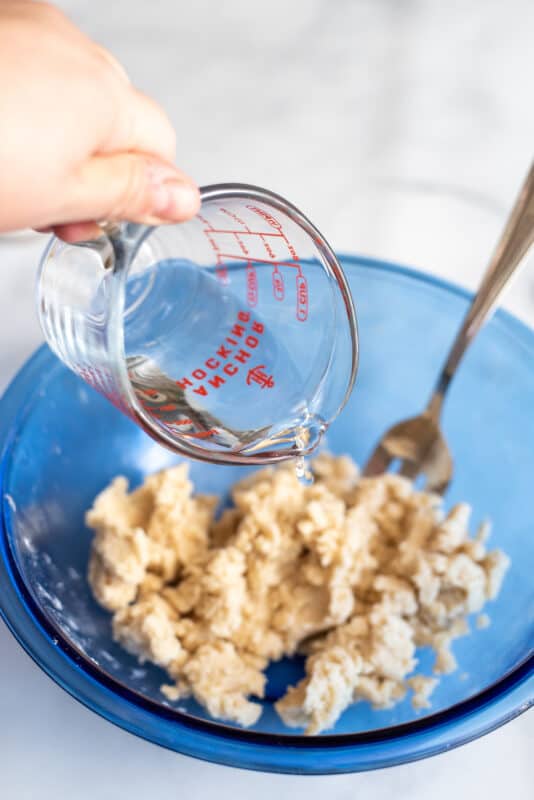 Add water to dough.