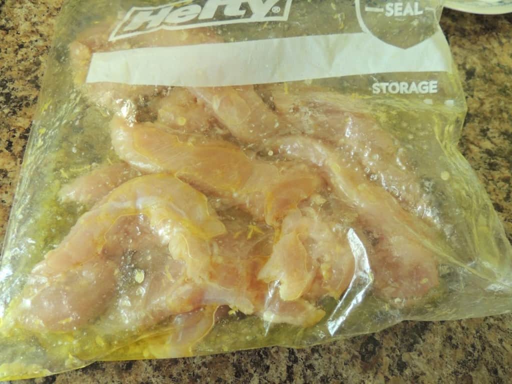 Place chicken and marinade in a sealed bag and let it marinate in the fridge.