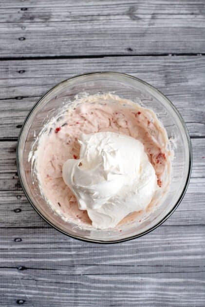 Add whipped topping to mixing bowl.