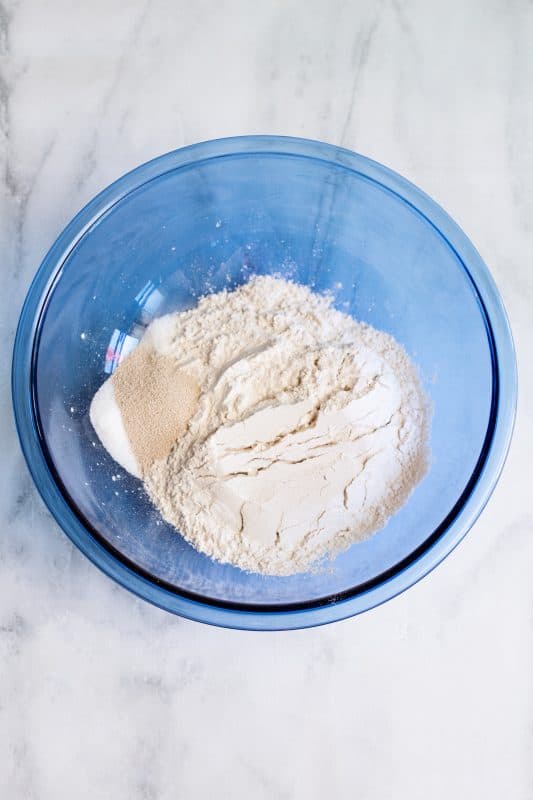 combine flour sugar salt and yeast in large bowl