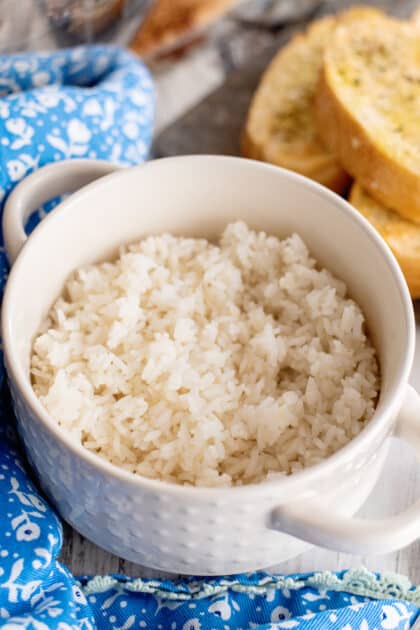 Place 1/2 cup of cooked rice into a bowl.