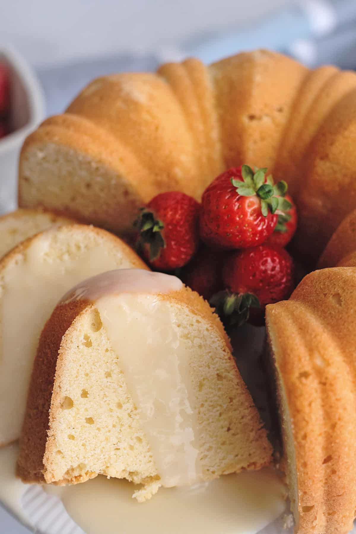 Slice of pound cake with custard sauce.