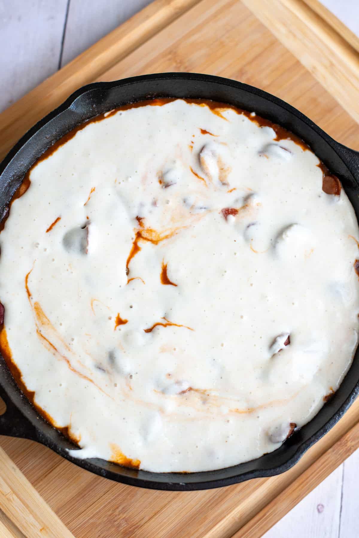 pour cornbread mix on top of the skillet