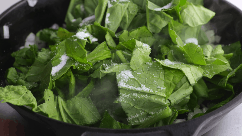 Add pinch of salt to greens.