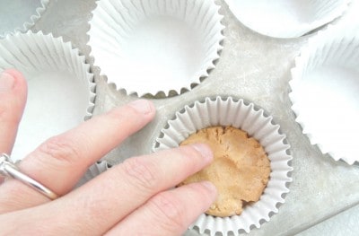 Press the ball into the muffin paper with your fingers.