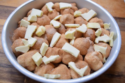 Add remaining butter to top of monkey bread.