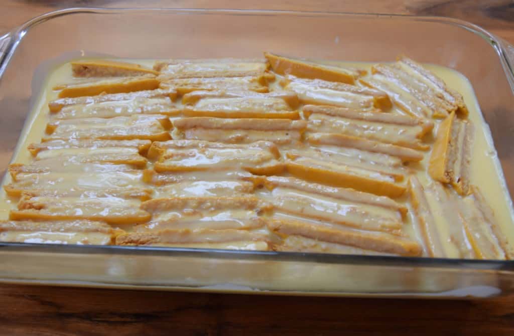 Moon Pies covered in pudding in baking dish.