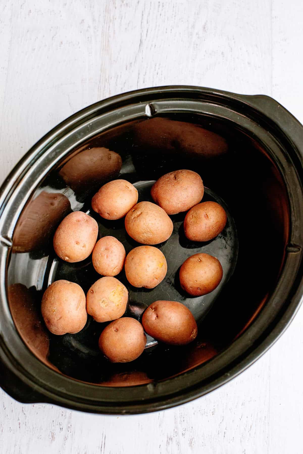 add potatoes to the crock pot