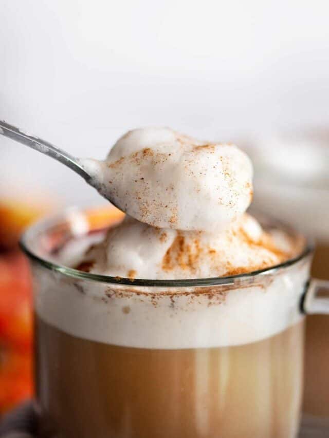 Spoonful of froth on top of sugar-free pumpkin spice latte.