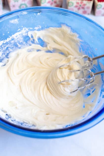 Beat cream cheese icing ingredients together with mixer.
