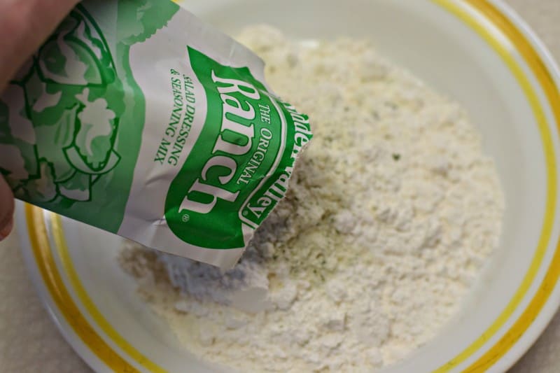 Stir together ranch dressing mix and flour.