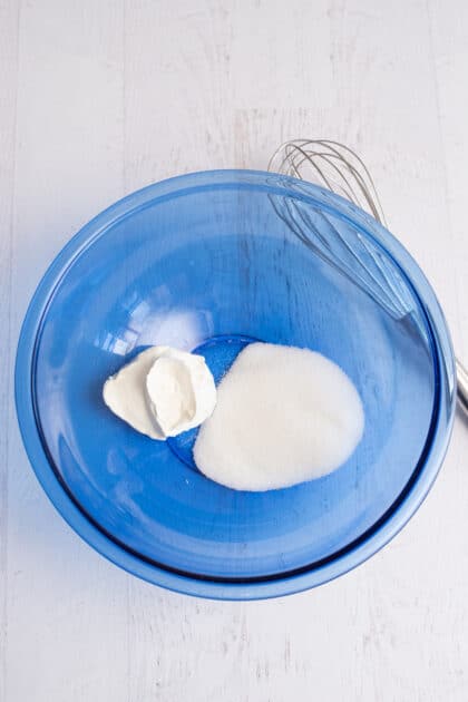 Place the sugar and sour cream in a large bowl and stir until well combined.