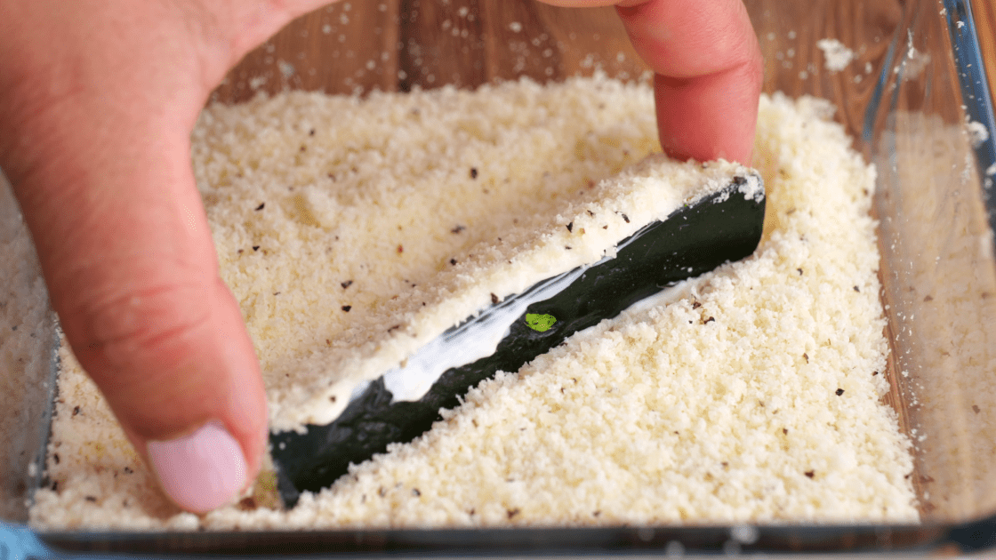 Press each cut side of zucchini in the breading mixture.