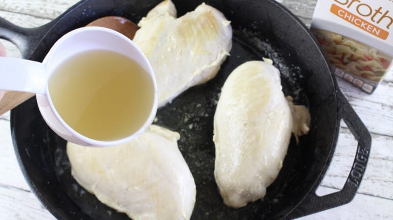 Add chicken broth to skillet and simmer.